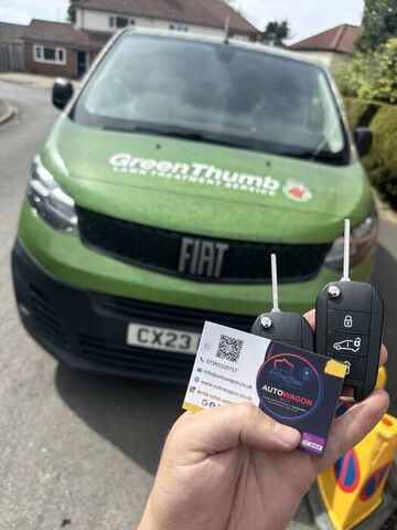 AutoWagon technician handing over a spare replacement key for a Fiat in Norfolk