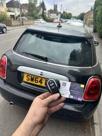 AutoWagon technician handing over a replacement key for a Mini in Norfolk