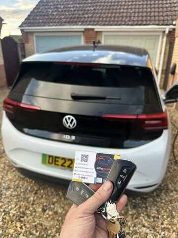 AutoWagon technician handing over a replacement key for a Renault Captur in Norfolk